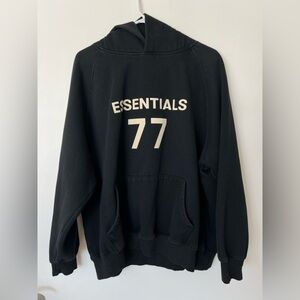 Fear of God Black Crewneck Hoodie with Cream '77' Print Front Pocket